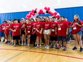 Children in gymnasium gathered for ADA Project Power
