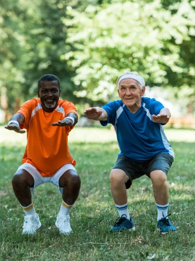 Senior men exercising in park