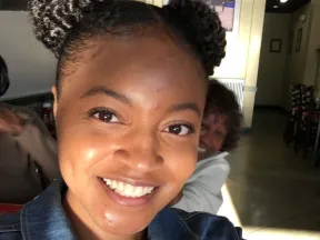 Woman taking a selfie and smiling at the camera