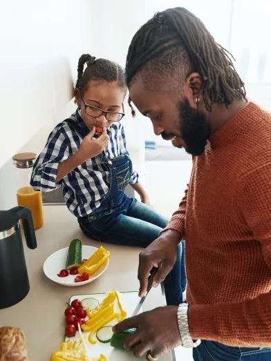 Father and daughter prepping healthy food