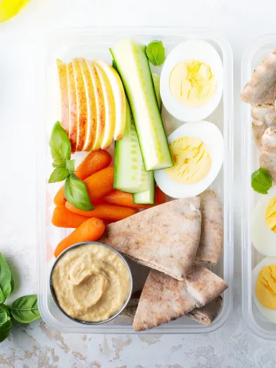 Two containers filled with healthy snacks for a diabetic friendly diet