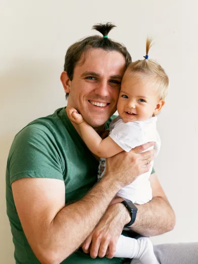 Smiling father with child